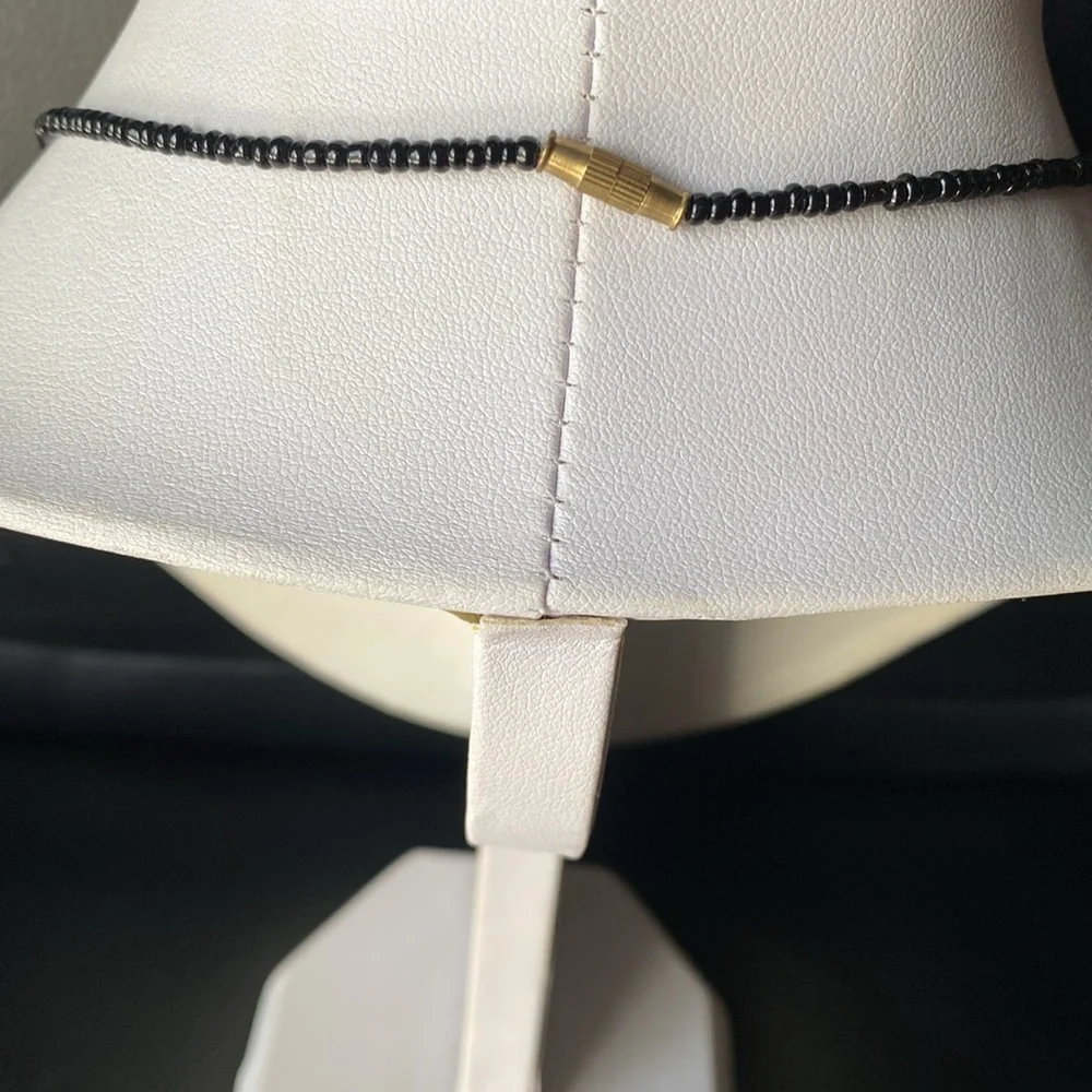 Black and Cream Beaded Necklace with Mask Pendant